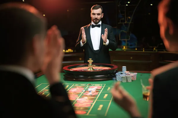 A glamorous woman holding casino chips in a neon-lit environment, representing the premium online casino atmosphere of BDKO.